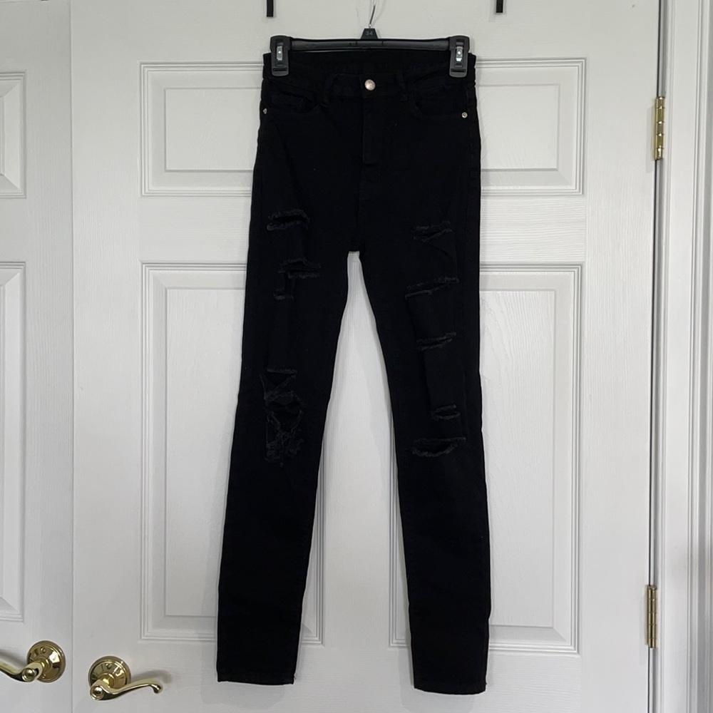 Women’s black ripped jeans, size S
